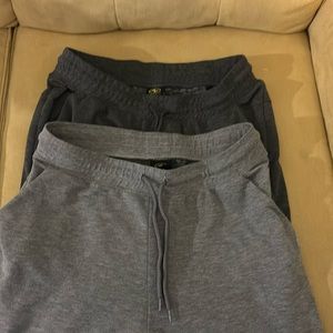 Two pair Gray sweatpants. One dark gray and one light gray. Size medium.